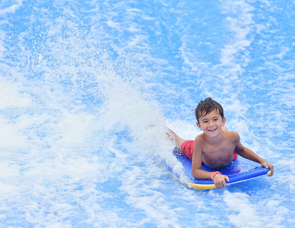 little boy on FlowRider