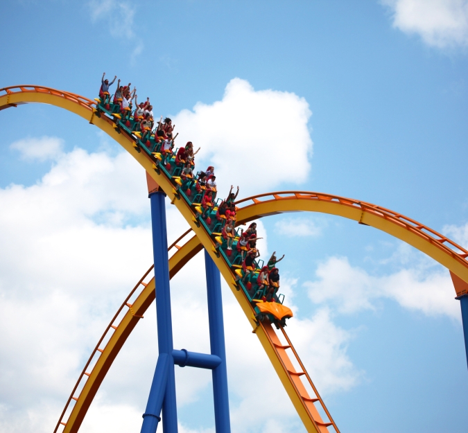 People riding rollercoaster