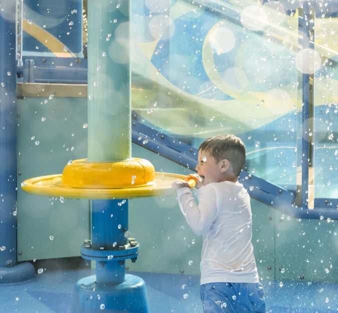 A child plays on the Aqua Cove playground at Surf and splash Waterpark